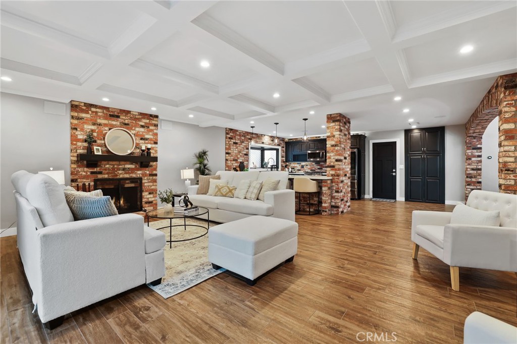 1810 Tanager Drive Costa Mesa, CA 92626 - Photo 14 of 55 a living room with fireplace furniture and a wooden floor