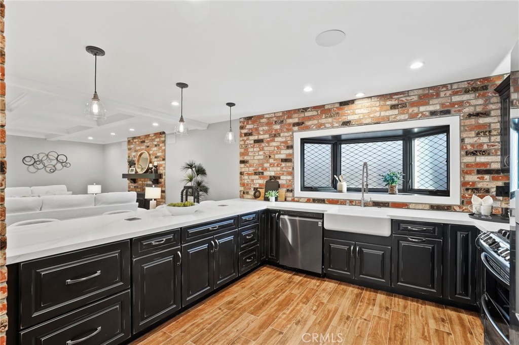 1810 Tanager Drive Costa Mesa, CA 92626 - Photo 19 of 55 a large kitchen with a sink and cabinets