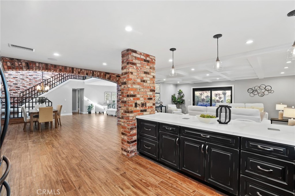 1810 Tanager Drive Costa Mesa, CA 92626 - Photo 20 of 55 a kitchen with stainless steel appliances granite countertop a lot of counter space and wooden floors