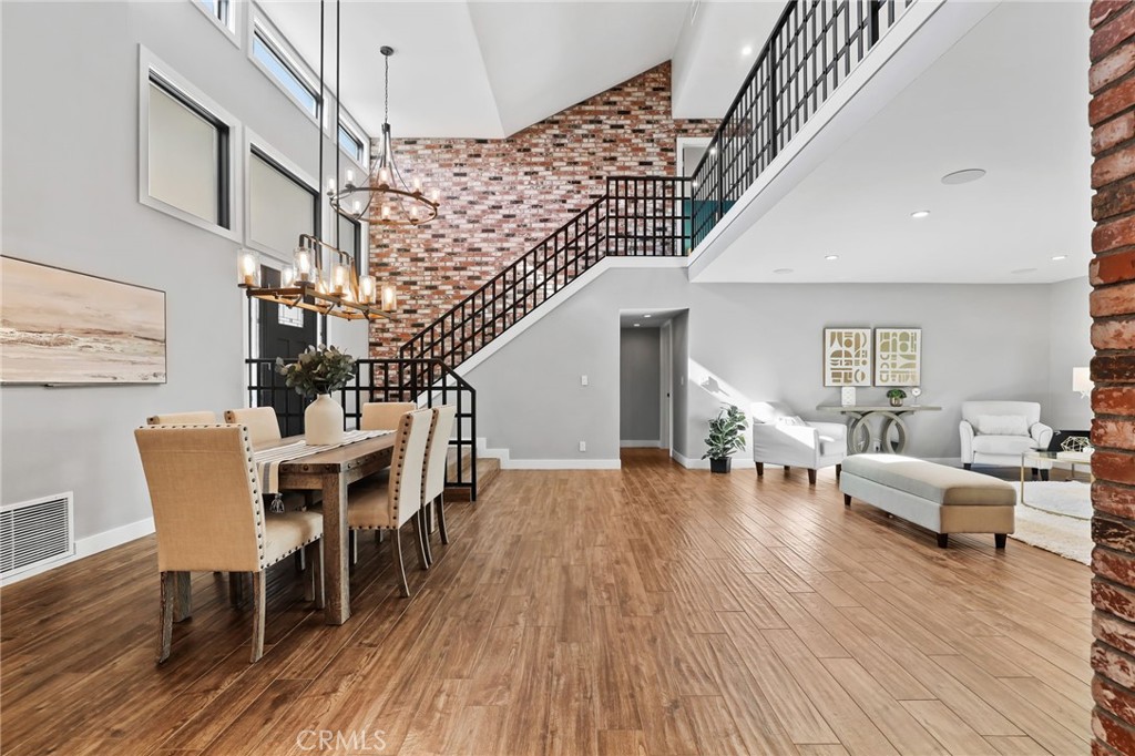1810 Tanager Drive Costa Mesa, CA 92626 - Photo 21 of 55 a view of livingroom with dining room and wooden floor