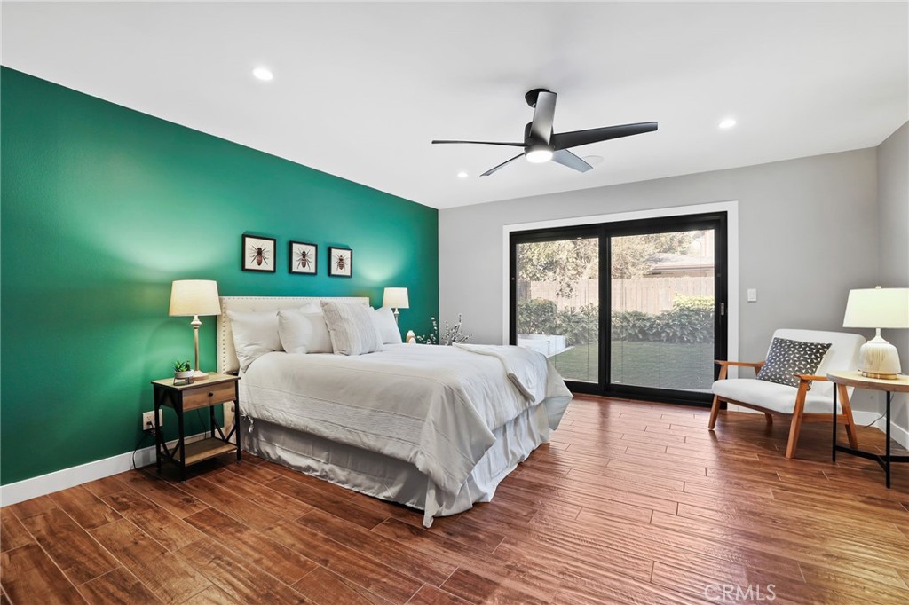 1810 Tanager Drive Costa Mesa, CA 92626 - Photo 24 of 55 a spacious bedroom with a bed and a large window