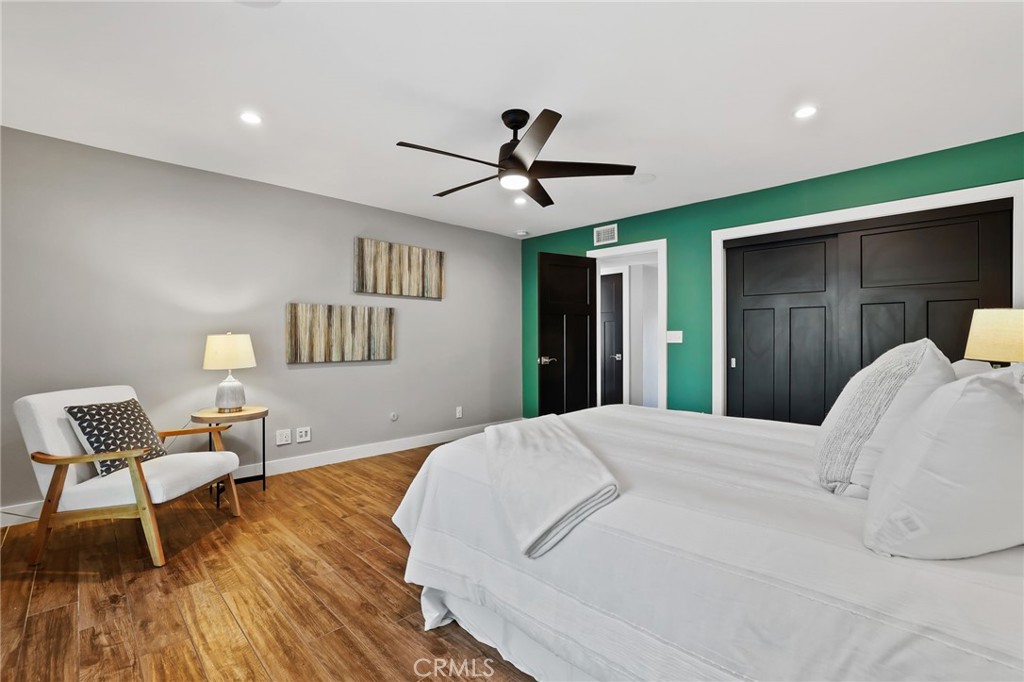 1810 Tanager Drive Costa Mesa, CA 92626 - Photo 25 of 55 a bedroom with a bed and a chair