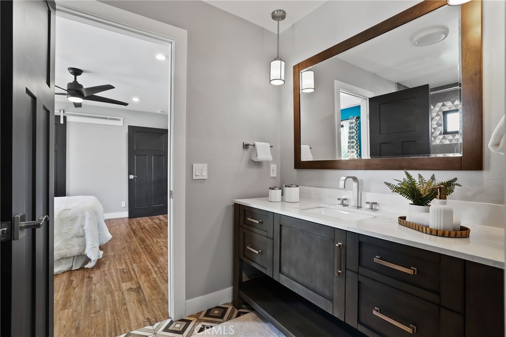 1810 Tanager Drive Costa Mesa, CA 92626 - Photo 29 of 55 a en suite bathroom with a double vanity sink and a mirror