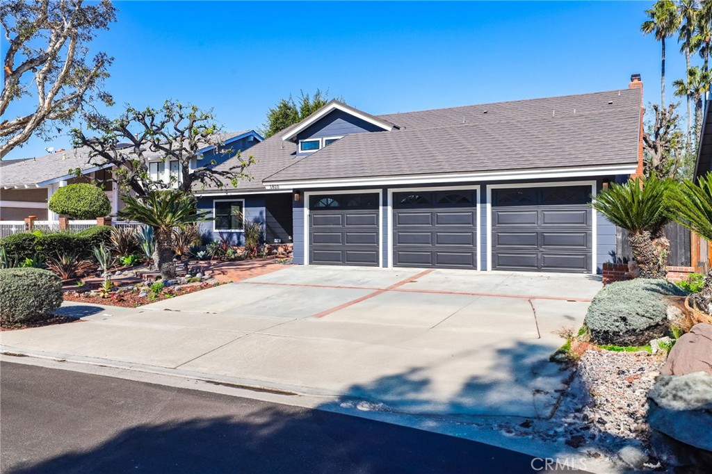 1810 Tanager Drive Costa Mesa, CA 92626 - Photo 3 of 55 a front view of a house with a garage