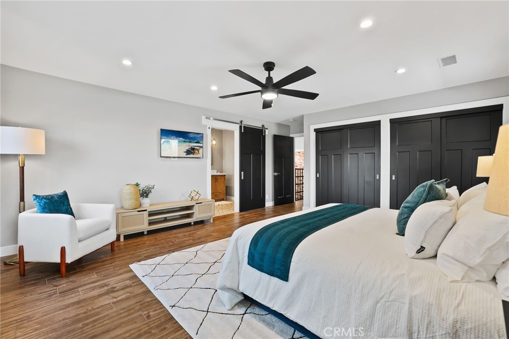 1810 Tanager Drive Costa Mesa, CA 92626 - Photo 33 of 55 a spacious bedroom with a bed and a couch