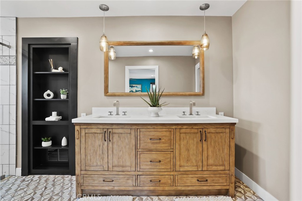 1810 Tanager Drive Costa Mesa, CA 92626 - Photo 34 of 55 a bathroom with a sink and a mirror