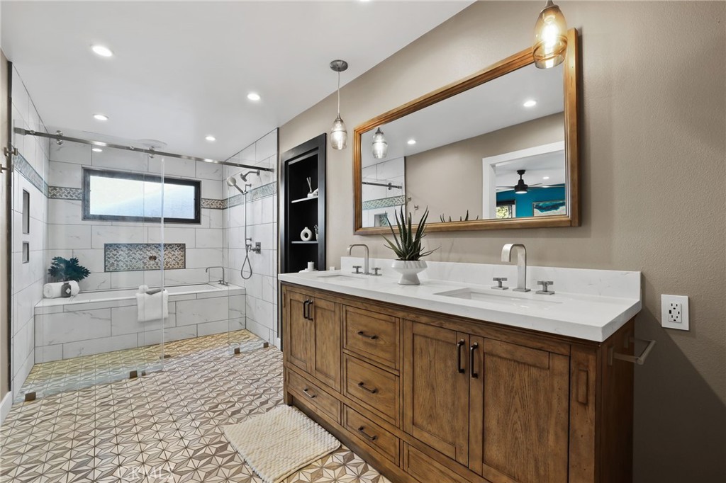 1810 Tanager Drive Costa Mesa, CA 92626 - Photo 35 of 55 a large bathroom with a double vanity sink a mirror and a