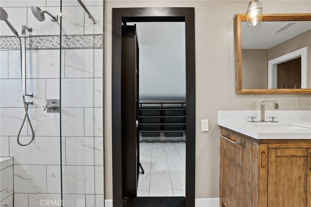 1810 Tanager Drive Costa Mesa, CA 92626 - Photo 37 of 55 a bathroom with a shower and a sink
