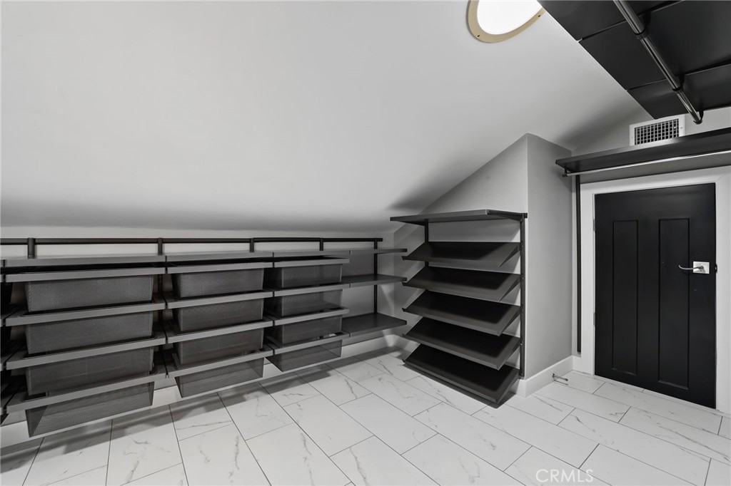 1810 Tanager Drive Costa Mesa, CA 92626 - Photo 38 of 55 a view of walk in closet with empty racks