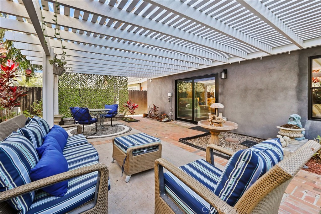 1810 Tanager Drive Costa Mesa, CA 92626 - Photo 42 of 55 a living room with furniture and a large window