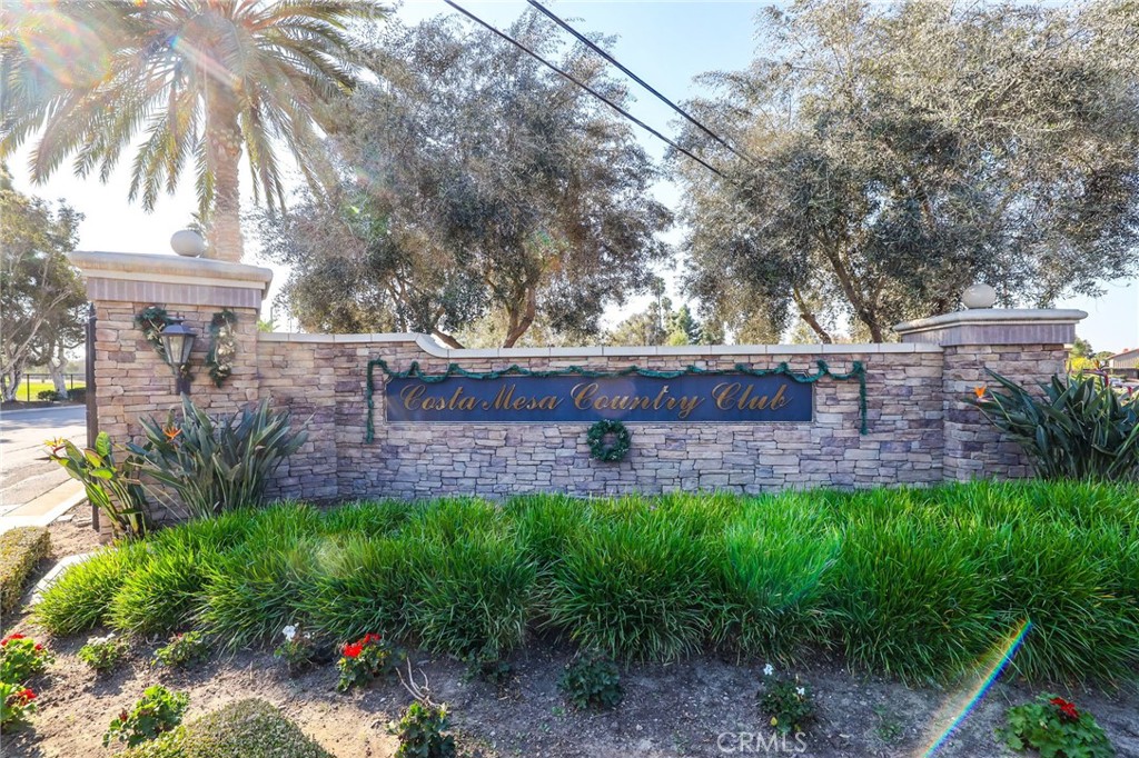 1810 Tanager Drive Costa Mesa, CA 92626 - Photo 49 of 55 a view of a backyard with table and chairs plants and large trees