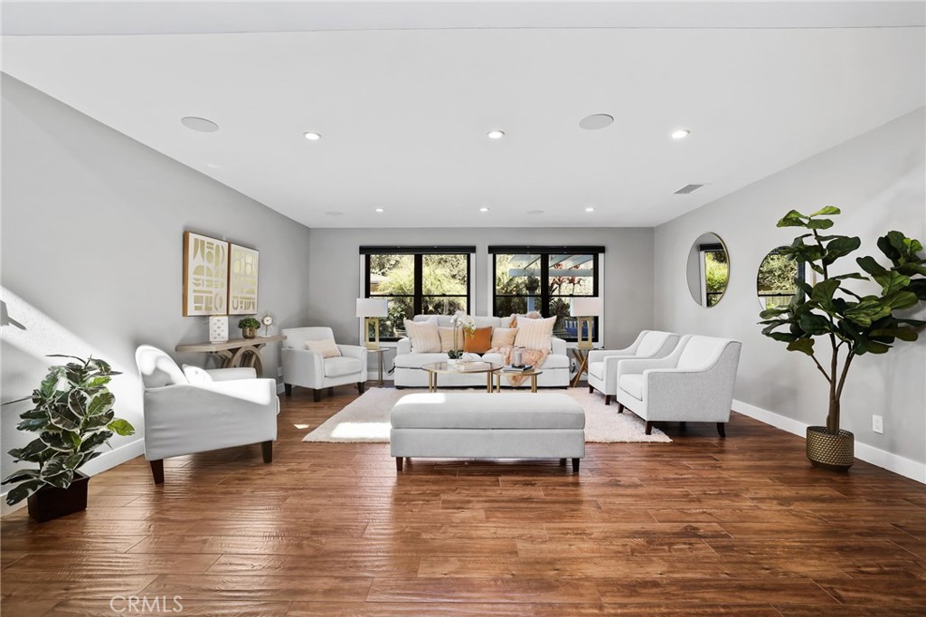 1810 Tanager Drive Costa Mesa, CA 92626 - Photo 8 of 55 a living room with furniture and a wooden floor