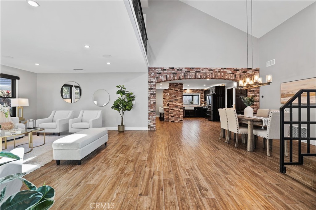 1810 Tanager Drive Costa Mesa, CA 92626 - Photo 10 of 55 a living room with furniture a bookshelf and wooden floor