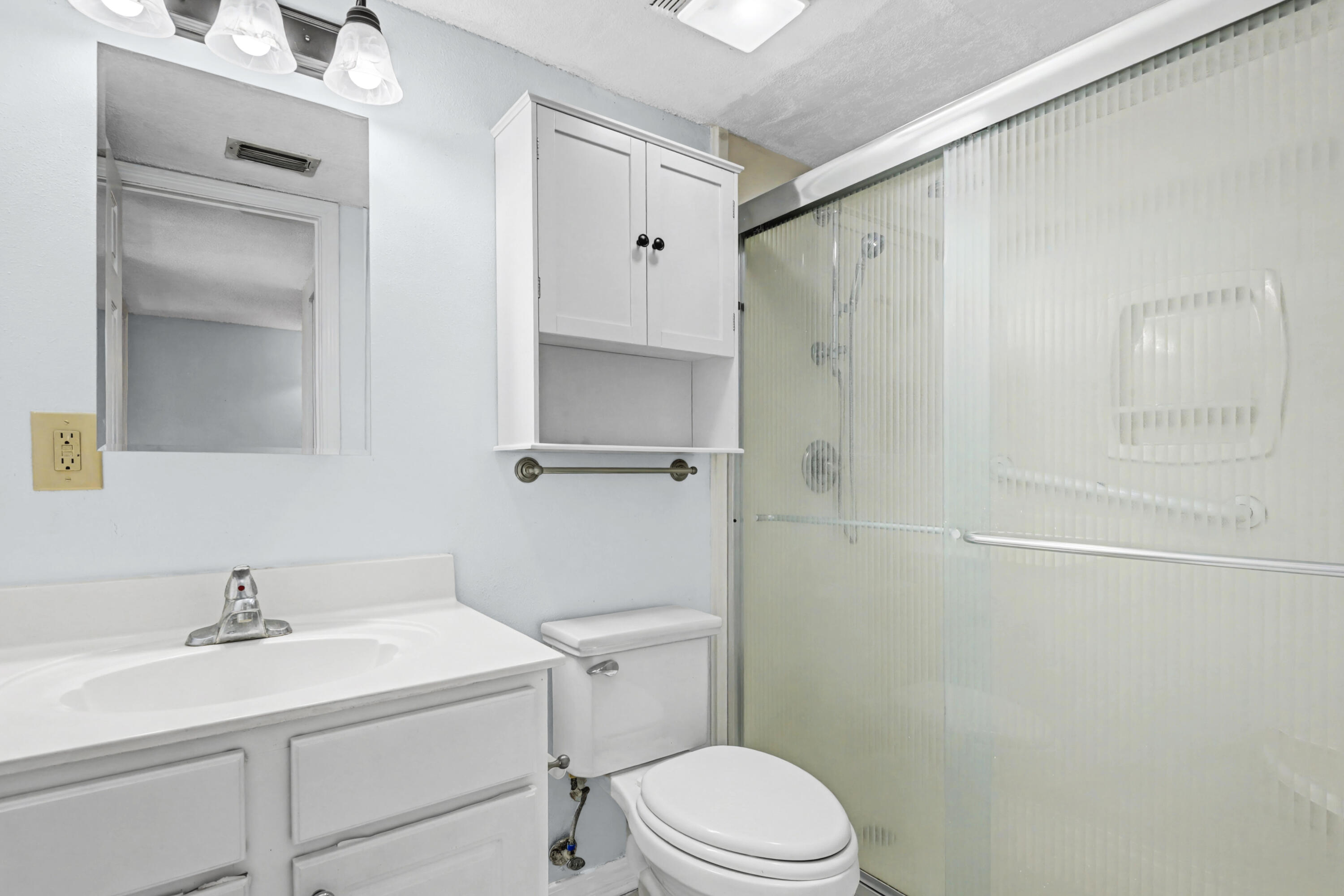 101 Old Ferry Road, Unit 10B Shalimar, FL 32579 - Photo 15 of 30 a bathroom with a sink toilet and vanity