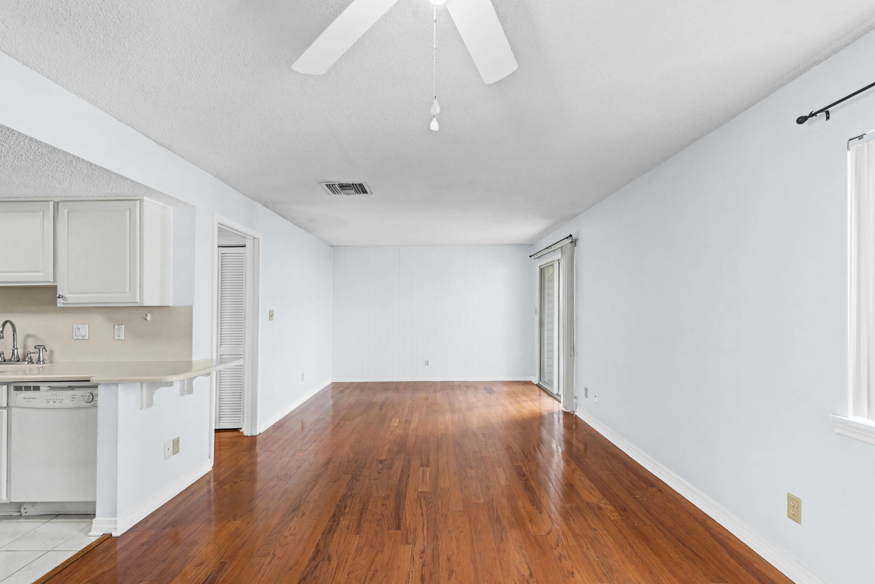 101 Old Ferry Road, Unit 10B Shalimar, FL 32579 - Photo 3 of 30 a view of a kitchen with wooden floor and electronic appliances