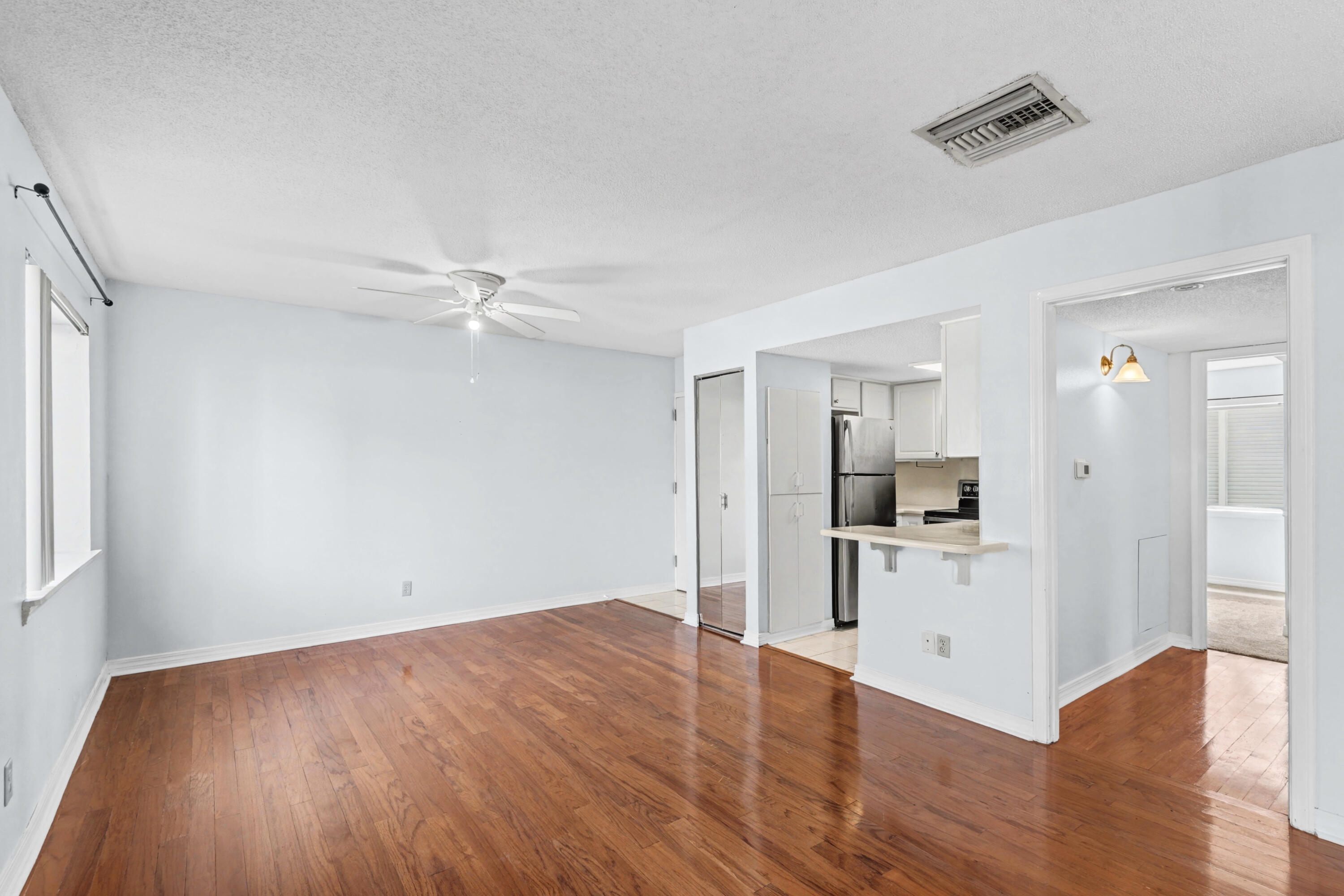 101 Old Ferry Road, Unit 10B Shalimar, FL 32579 - Photo 6 of 30 a view of kitchen with furniture and wooden floor