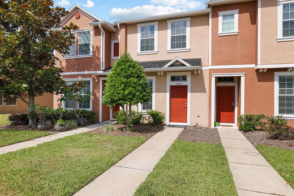 front view of a house with a yard