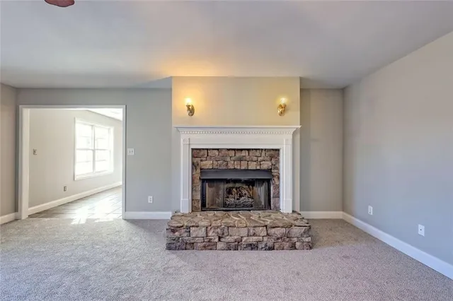 a view of swimming pool with a garden and seating area