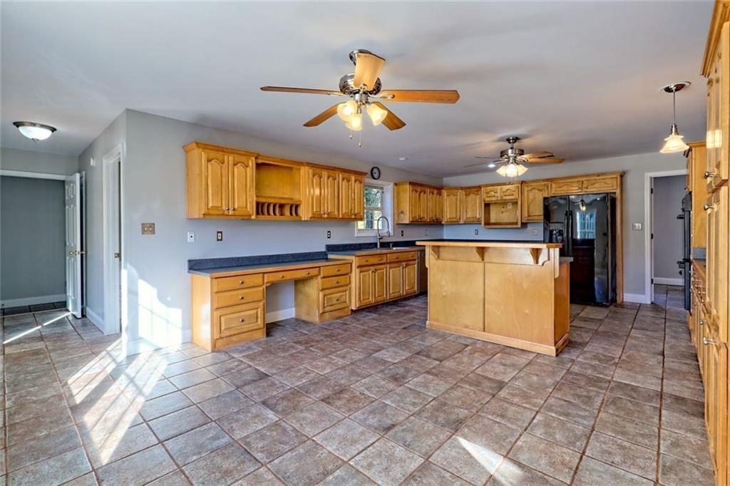 539 B B Wilson Road Commerce, GA 30529 - Photo 25 of 70 a kitchen with stainless steel appliances granite countertop a refrigerator and a sink
