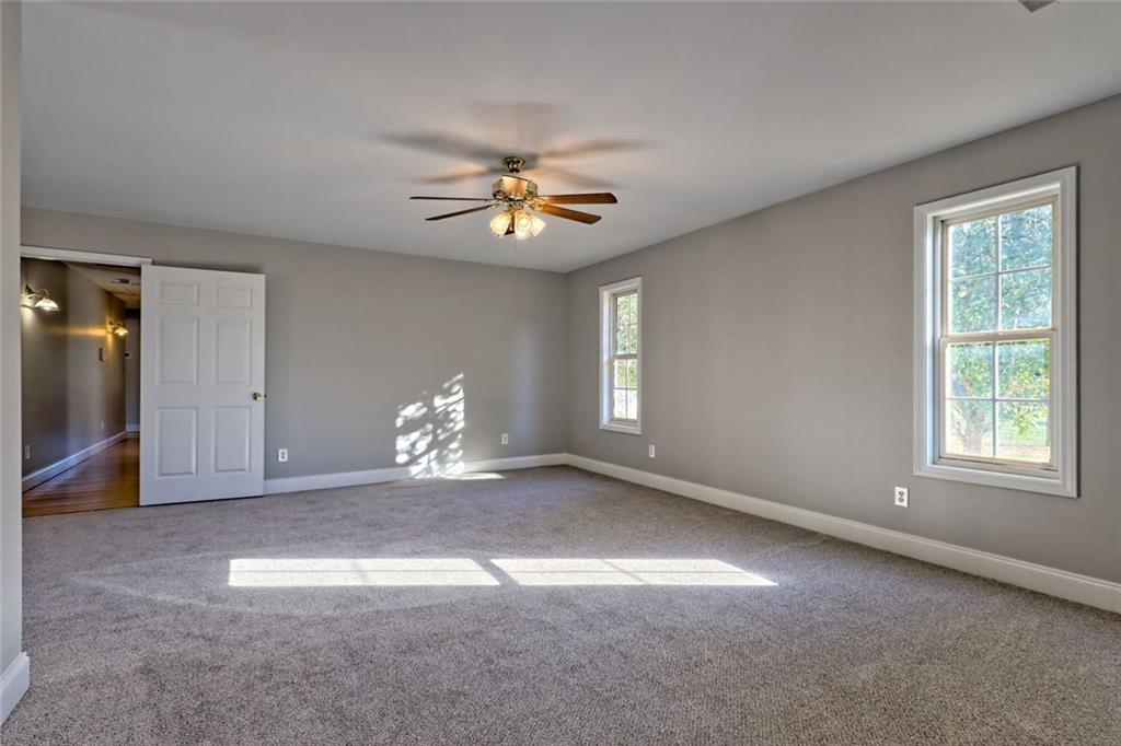 539 B B Wilson Road Commerce, GA 30529 - Photo 30 of 70 a view of a livingroom with a ceiling fan and window
