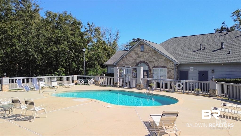 303 Wyld Palms Drive, Unit 303 Foley, AL 36535 - Photo 30 of 36 Community pool featuring a patio