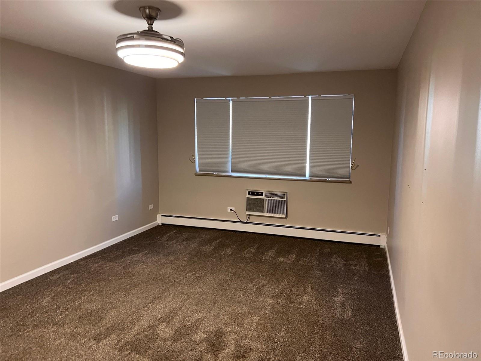 660 South Alton Way, Unit 4A Denver, CO 80247 - Photo 14 of 28 a view of an empty room with a window