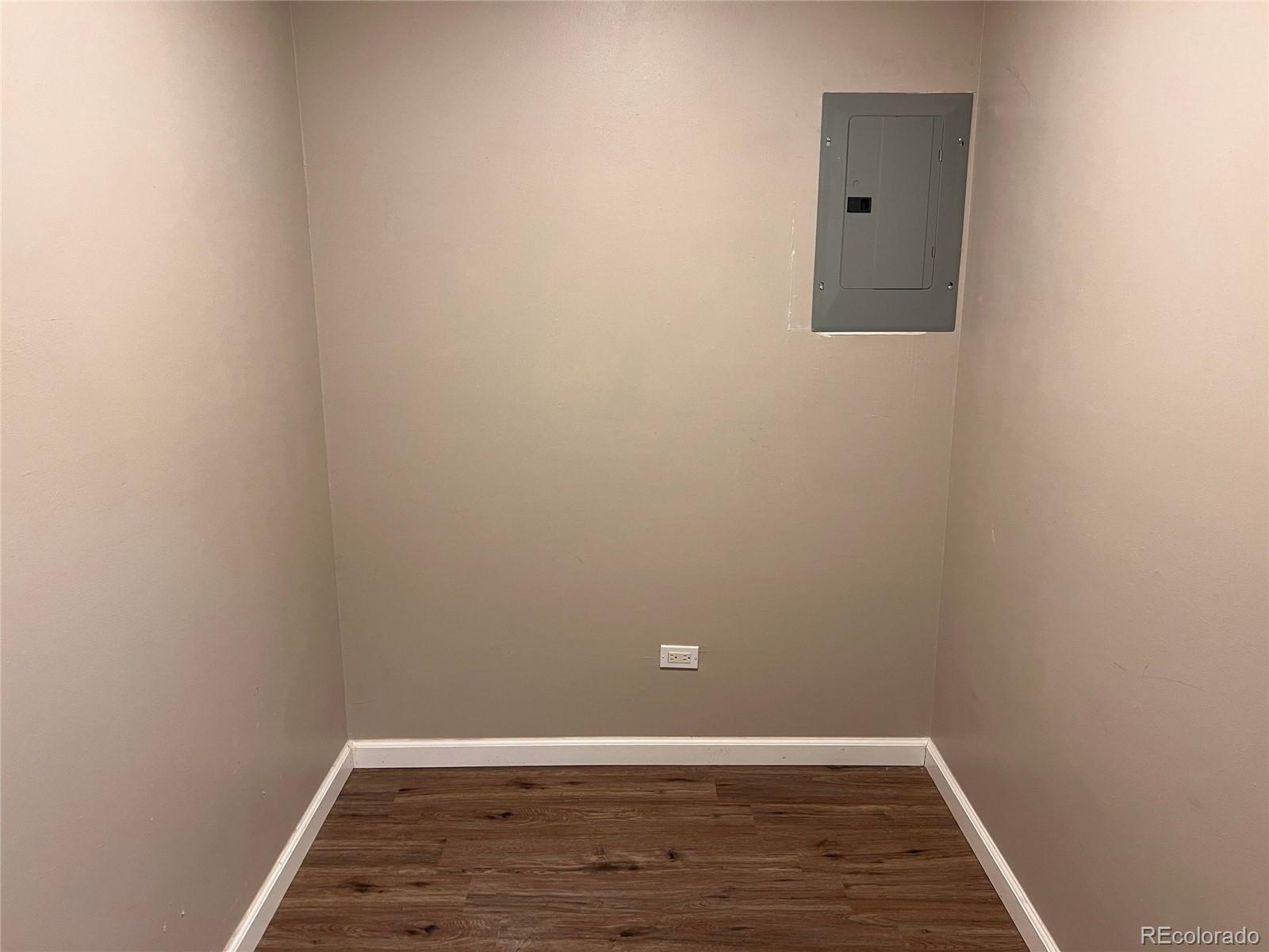 660 South Alton Way, Unit 4A Denver, CO 80247 - Photo 16 of 28 a view of a room with wooden floor