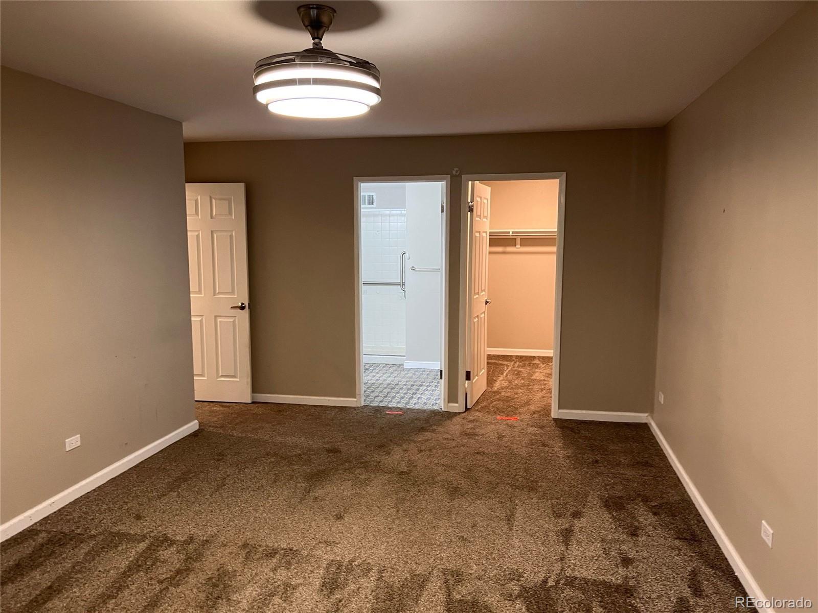 660 South Alton Way, Unit 4A Denver, CO 80247 - Photo 17 of 28 a view of an empty room with a window