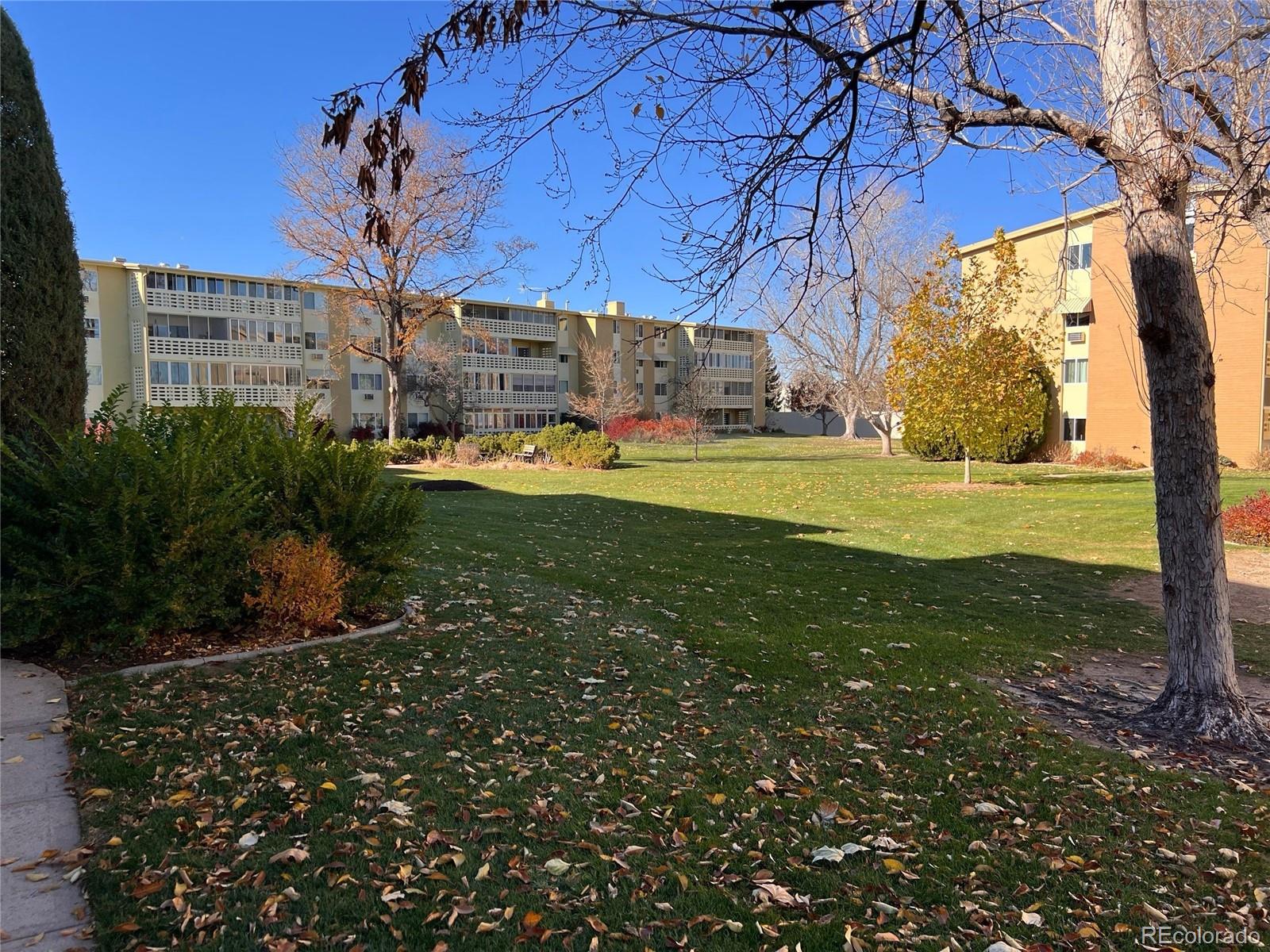660 South Alton Way, Unit 4A Denver, CO 80247 - Photo 24 of 28 a view of a house with a yard