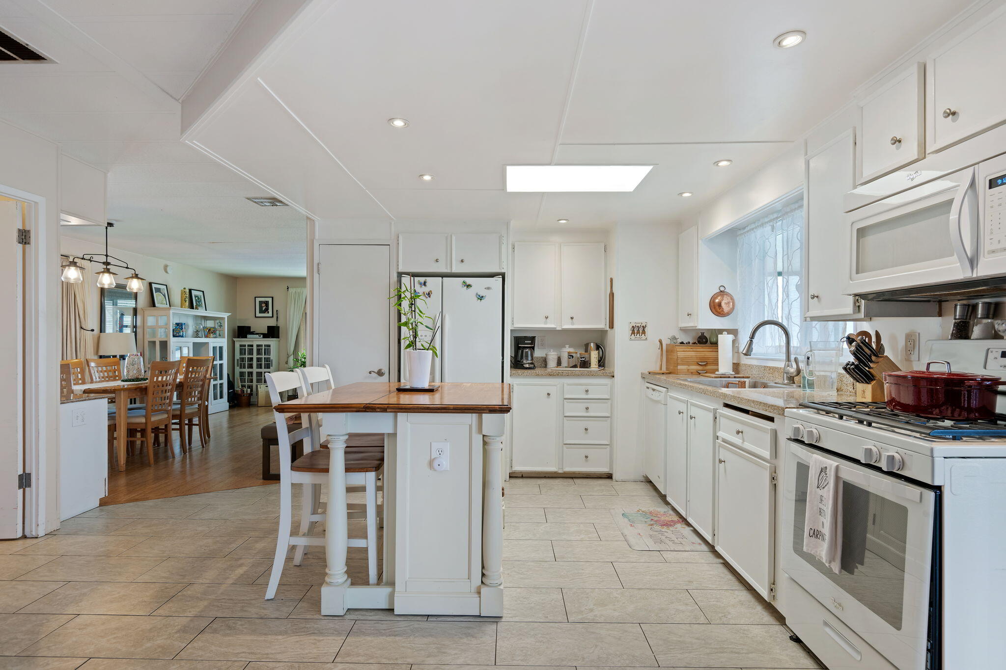 6180 Via Real, Unit 32 Carpinteria, CA 93013 - Photo 12 of 34 a kitchen with appliances cabinets and chair