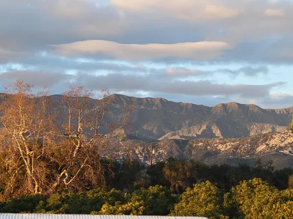 a view of a city with mountains in the background