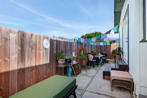 a view of a chairs and tables in patio