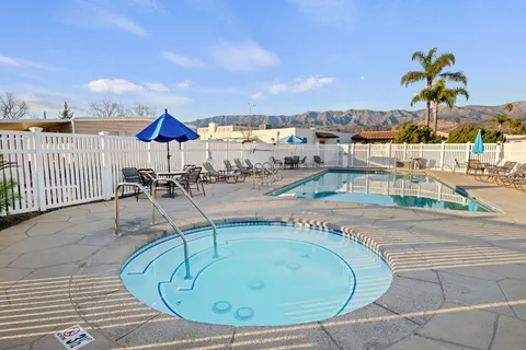 a view of a swimming pool with a patio