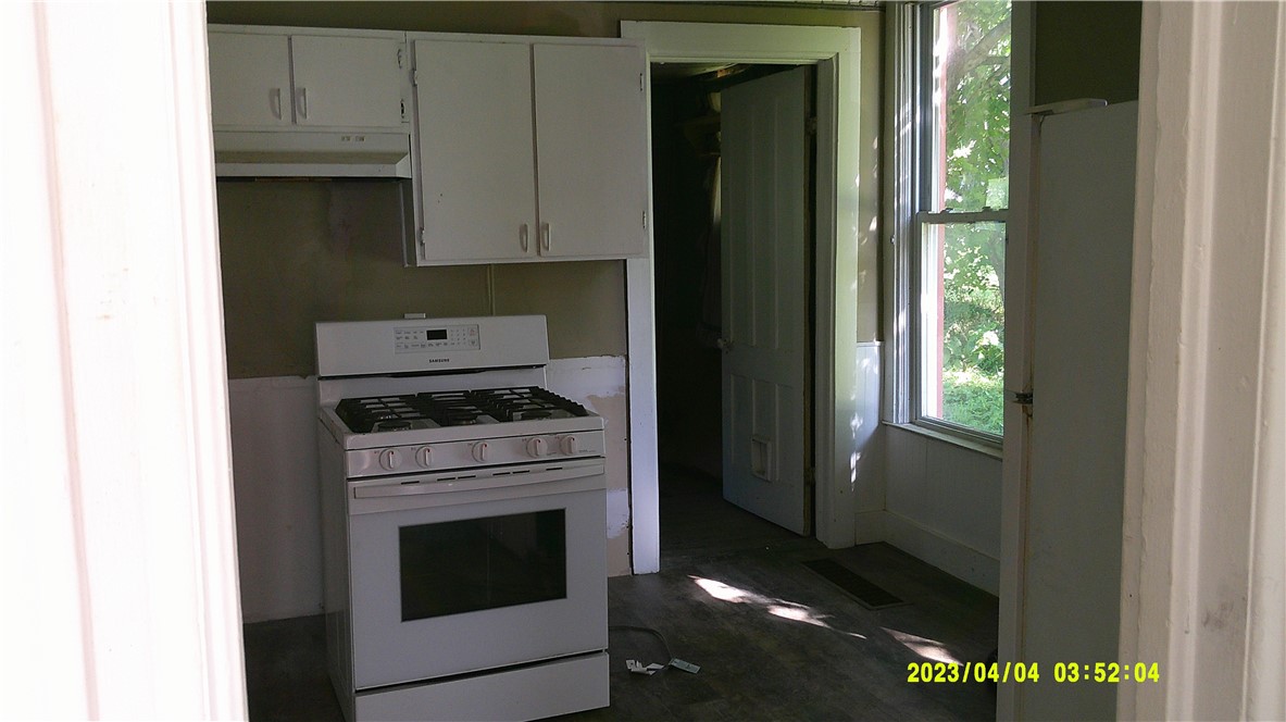 1878 Fairground Road Brookfield, NY 13485 - Photo 6 of 21 Kitchen walking through to utility room
