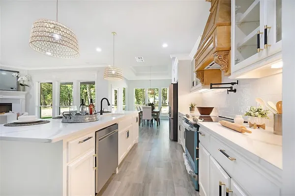 a kitchen with a sink stove and cabinets