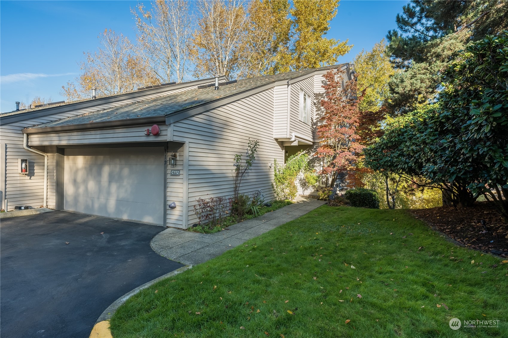 7250 Old Redmond Road, Unit C112 Redmond, WA 98052 - Photo 1 of 30 a view of a house with a yard