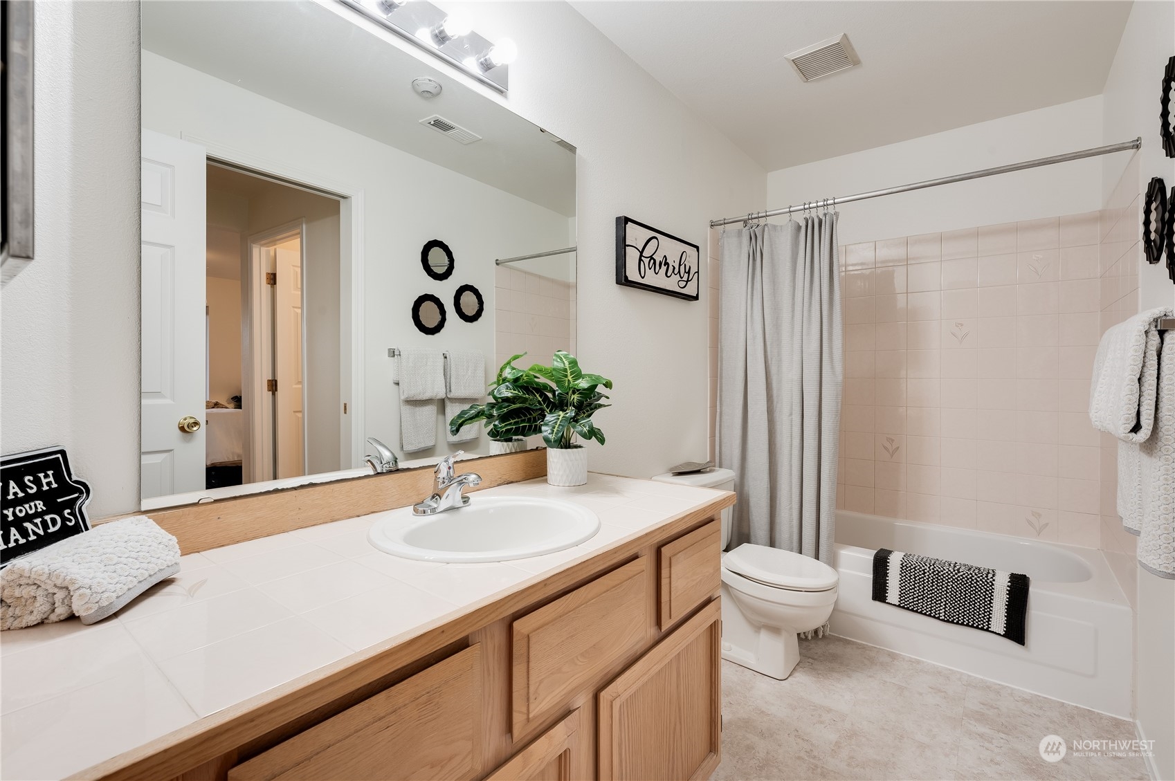 7250 Old Redmond Road, Unit C112 Redmond, WA 98052 - Photo 20 of 30 a bathroom with a granite countertop sink and a mirror