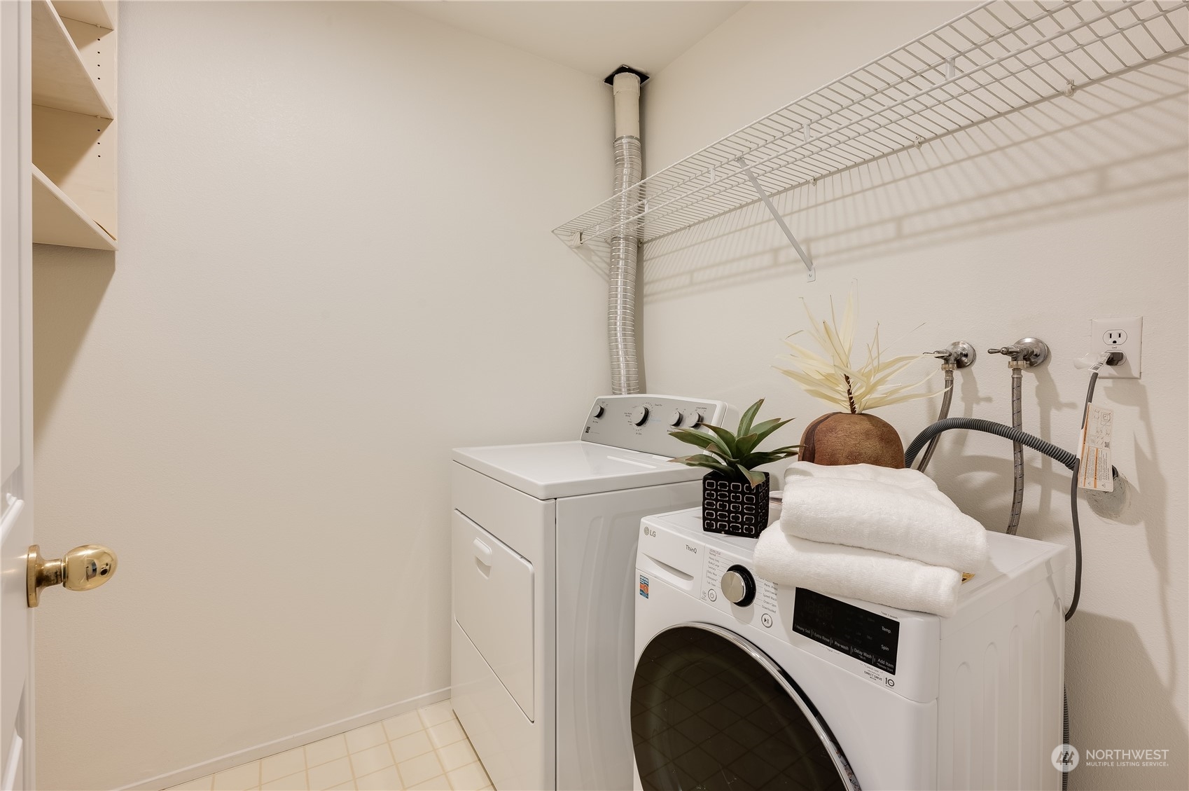7250 Old Redmond Road, Unit C112 Redmond, WA 98052 - Photo 21 of 30 a view of washer and dryer with bathroom in the background