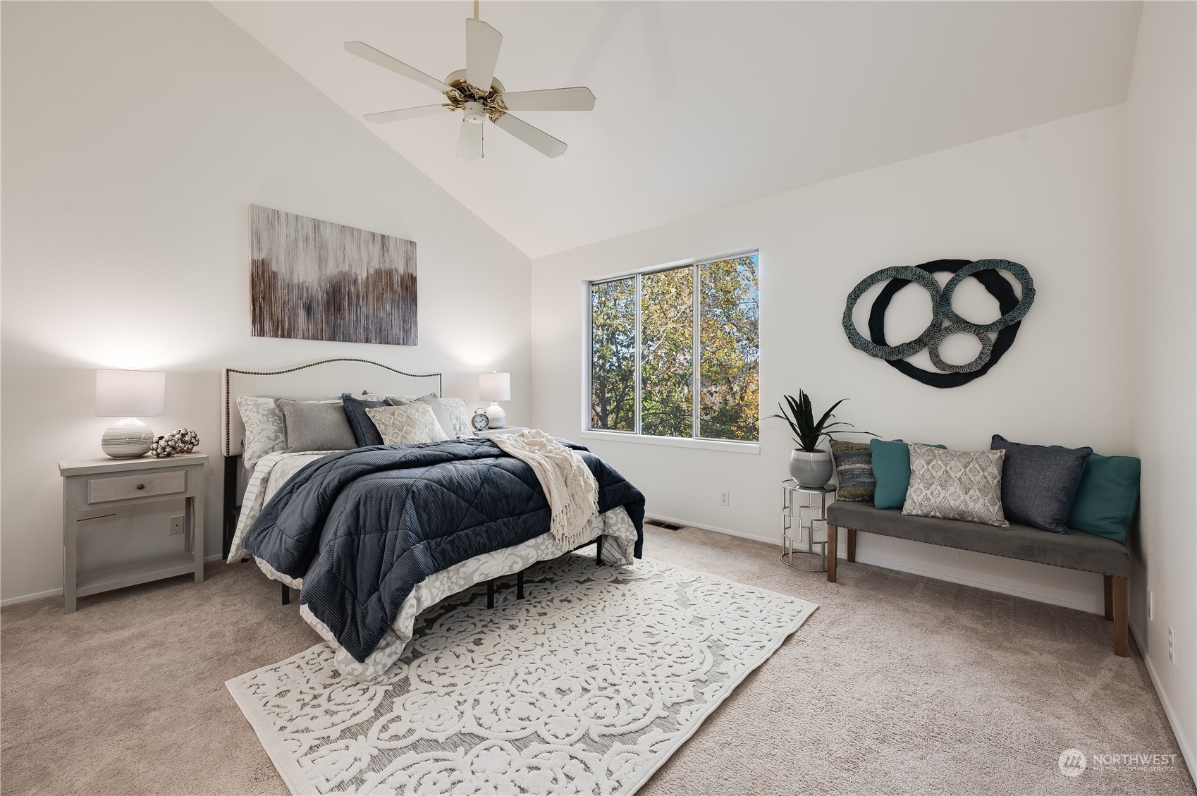 7250 Old Redmond Road, Unit C112 Redmond, WA 98052 - Photo 23 of 30 a bedroom with a bed and a chandelier