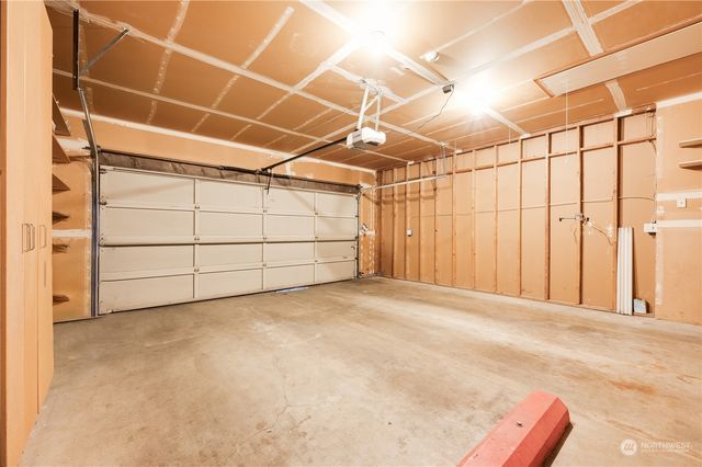 a view of a room with wooden walls