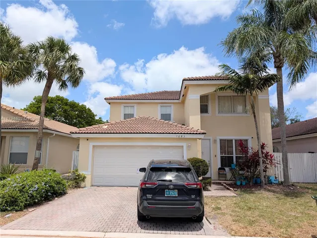 a car parked in front of a house