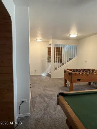 a bedroom with a bed and a sink