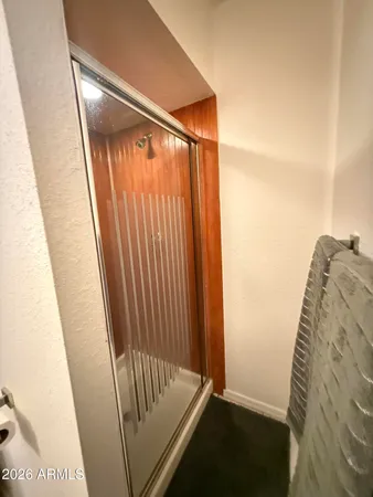 a view of a room with furniture and a window