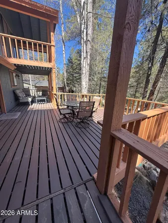 a view of fireplace with two chairs