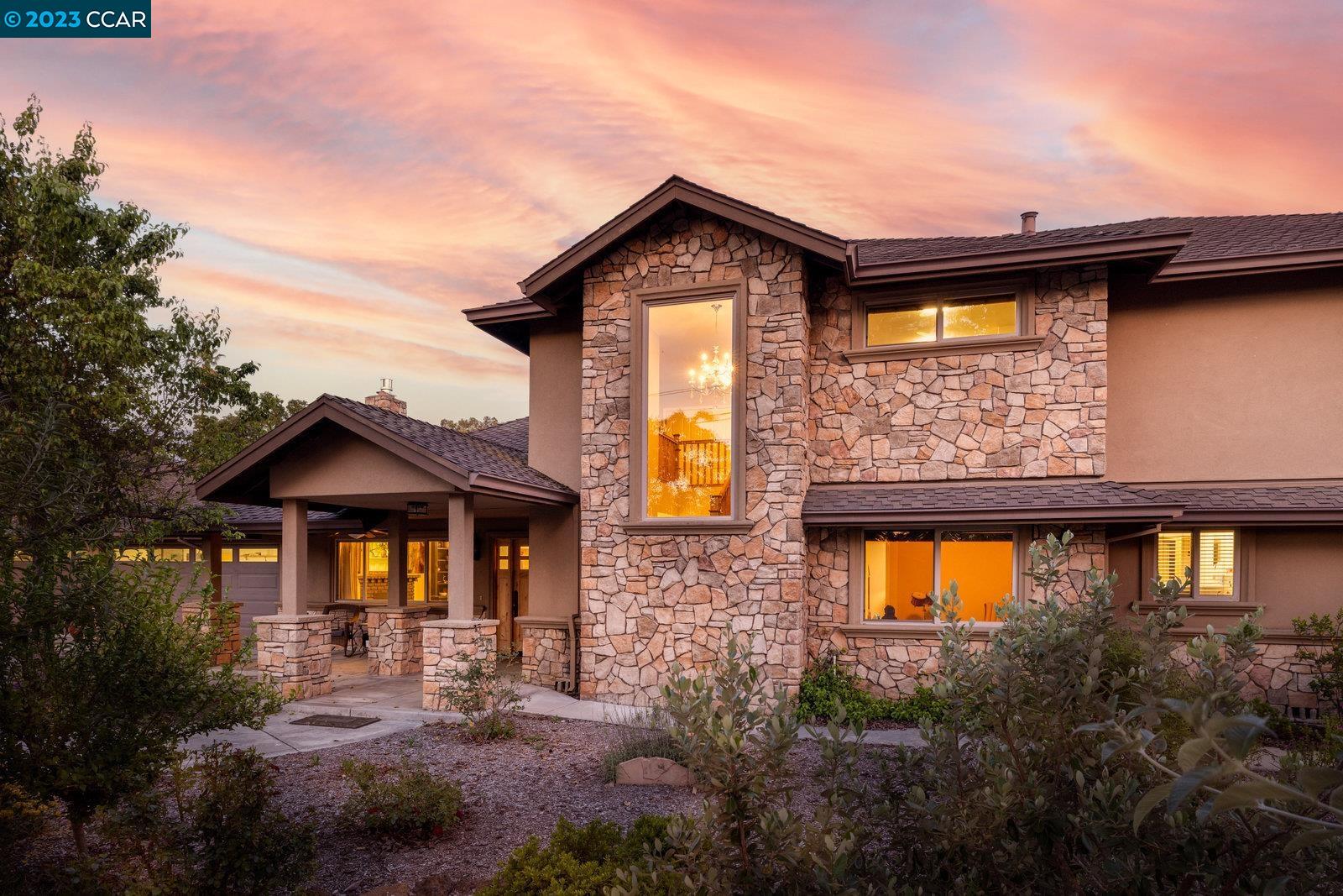 a front view of a house with yard