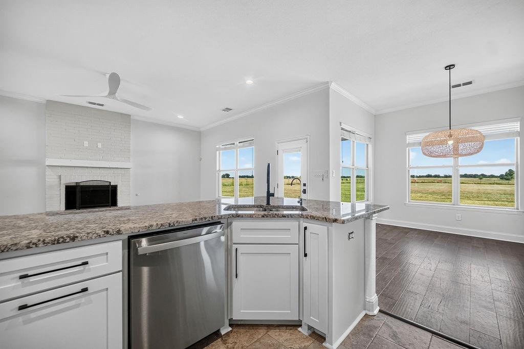 544 Gant Road Sherman, TX 75090 - Photo 8 of 39 Kitchen island with granite countertops and stainless steel appliances