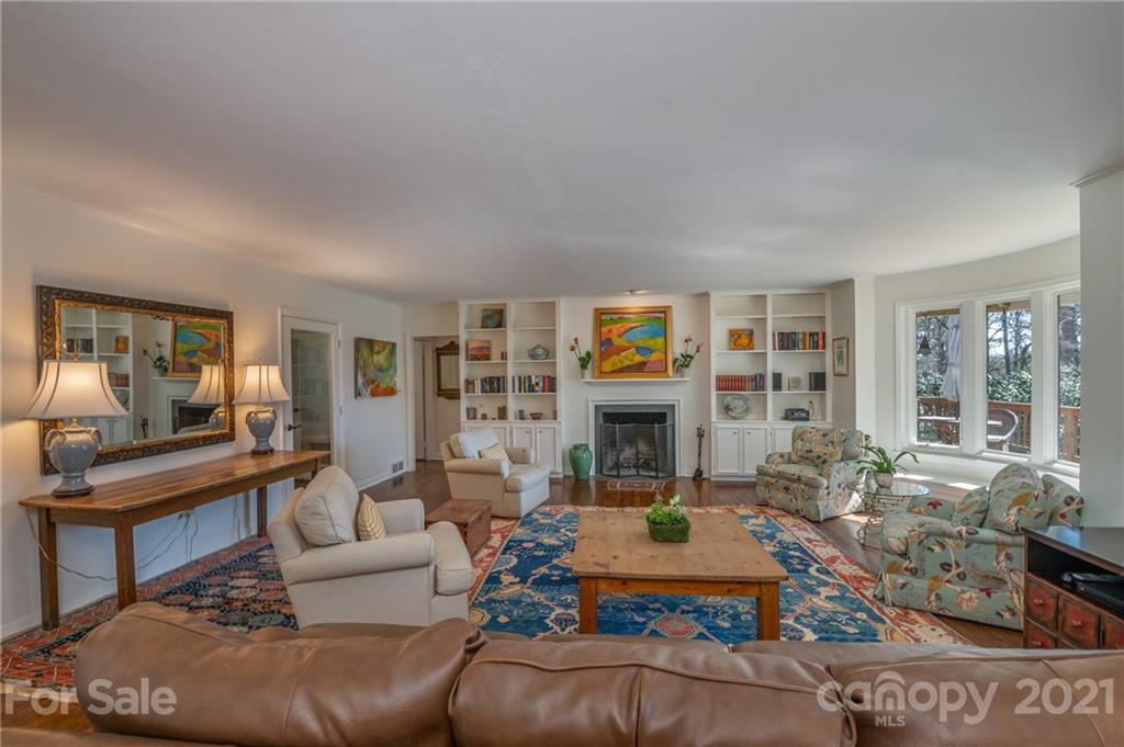 172 Wilderness Road Tryon, NC 28782 - Photo 11 of 46 a living room with furniture and a fireplace