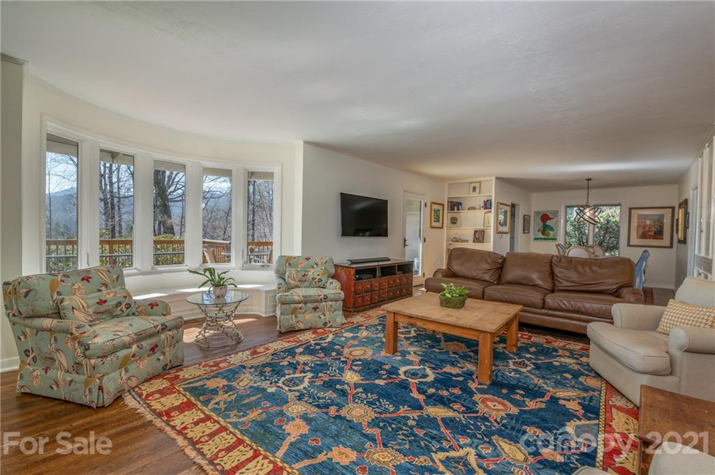 172 Wilderness Road Tryon, NC 28782 - Photo 12 of 46 a living room with furniture and a flat screen tv
