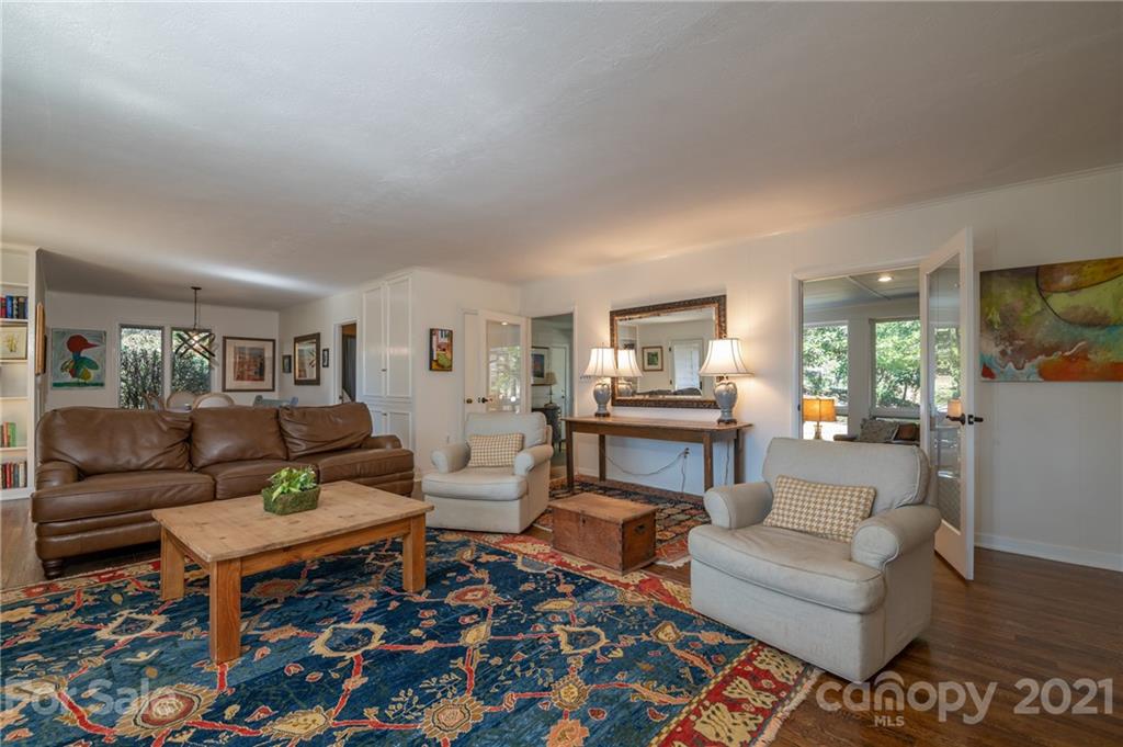 172 Wilderness Road Tryon, NC 28782 - Photo 13 of 46 a living room with furniture and a rug