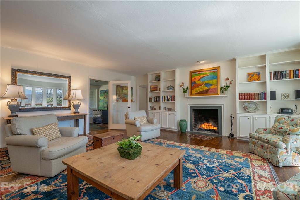 172 Wilderness Road Tryon, NC 28782 - Photo 14 of 46 a living room with furniture and a fireplace